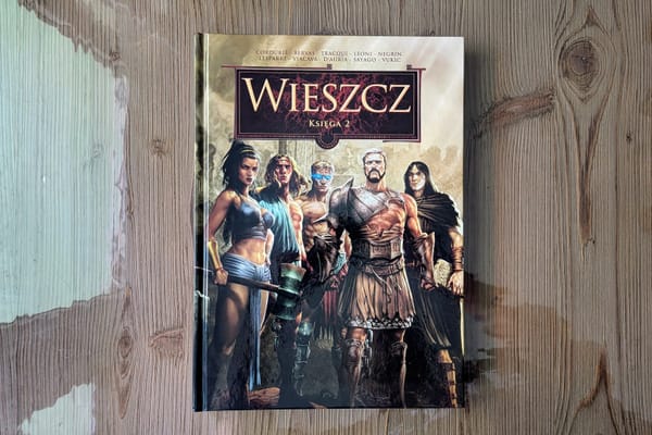 Komiks "Wieszcz. Księga 2" od wydawnictwa Lost In Time leżący na drewnianym stole.